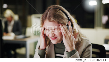Pain, stress or woman with headache in call center for sales deadline or customer service on break. Night, consultant and exhausted agent in telecom office with fatigue, migraine and burnout crisis Pain, stress or woman with headache in call center for sales deadline or customer service on break. Night, consultant and exhausted agent in telecom office with fatigue, migraine and burnout crisis 126102111