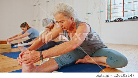 Elderly woman, stretching and feet in yoga class, flexibility and spiritual wellness. Senior person, muscle warm up and community for pilates, holistic practice and mobility exercise at health club Elderly woman, stretching and feet in yoga class, flexibility and spiritual wellness. Senior person, muscle warm up and community for pilates, holistic practice and mobility exercise at health club 126102147