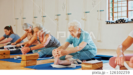 Elderly, people and stretching with band for yoga class, flexibility and spiritual wellness. Senior women, muscle warm up and community pilates, holistic practice and mobility exercise at health club Elderly, people and stretching with band for yoga class, flexibility and spiritual wellness. Senior women, muscle warm up and community pilates, holistic practice and mobility exercise at health club 126102259