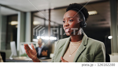 Woman, callcenter and phone call at night in office for contact us, communication or telecom agency. Coworking, colleague and CRM for help desk, support or advice with late shift agent in workplace 126102280