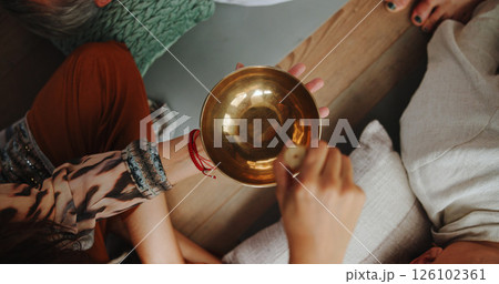 Hands, person and bowl for Tibetan singing for healing, sound ritual and vibration therapy. Above, healer and people with instrument for soul music, meditation and spiritual mantra for Buddha culture 126102361