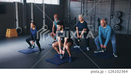 Fitness, kettlebells and people in gym, instructor and training with wellness, weightlifting and exercise. Health club, trainer and senior group with equipment, strength and strong arms with workout 126102364