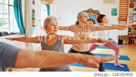 Elderly people, stretching and class for yoga with zen, fitness exercise and spiritual wellness. Senior women, warrior pose and community pilates, holistic practice and body balance at health club 126102408