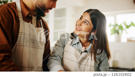 Happy, cooking and couple in kitchen in home together for bonding, talking and connection. Conversation, helping and man with woman for preparing meal, food or dinner for health diet in apartment. 126102602