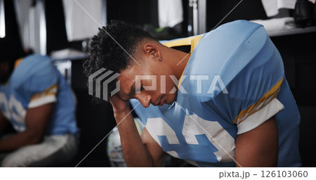 Man, American football player and headache with stress in locker room, frustrated or concussion with sport injury. Person, migraine and professional athlete with cte, tired and burnout at franchise Man, American football player and headache with stress in locker room, frustrated or concussion with sport injury. Person, migraine and professional athlete with cte, tired and burnout at franchise 126103060