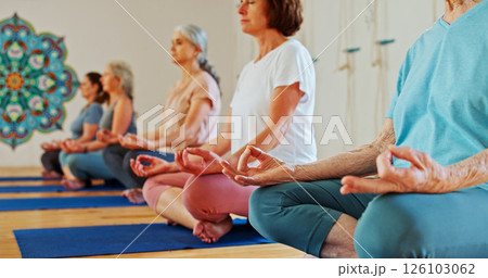 Hands, lotus and women with meditation class for calm mindset, zen or peace in mental wellness. Posture, morning and people in group together for mindfulness, relax or holistic self care on yoga mat 126103062