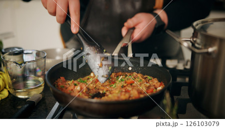 Person, hands and cooking with stove for food, meal prep or hospitality in kitchen at home. Closeup, culinary artist or mixing ingredients with pan for recipe, nutrition or dinner cuisine at house Person, hands and cooking with stove for food, meal prep or hospitality in kitchen at home. Closeup, culinary artist or mixing ingredients with pan for recipe, nutrition or dinner cuisine at house 126103079