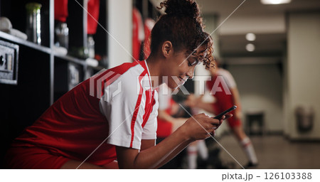 Fitness, watching and woman with smartphone, smile and browsing of video on social media and online. Happy, football player and person with mobile for streaming, healthy and girl with sportswear Fitness, watching and woman with smartphone, smile and browsing of video on social media and online. Happy, football player and person with mobile for streaming, healthy and girl with sportswear 126103388