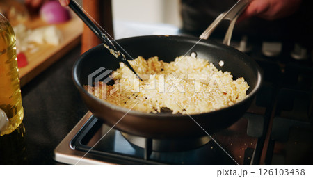 Cooking, pan and rice with person in kitchen of restaurant closeup for diet, health or nutrition. Gas stove, ingredients and risotto with chef in hotel for gourmet cuisine, hospitality or service 126103438