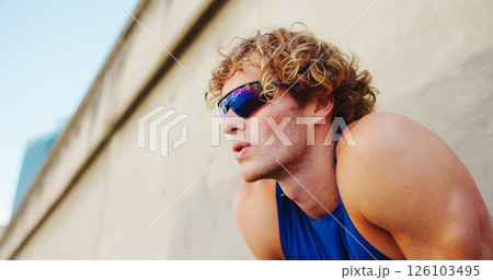 Thinking, breathing and runner or man with glasses in city for workout, marathon training and resting. Reflection, exercise and wellness with male person downtown for cardio, athlete and health 126103495