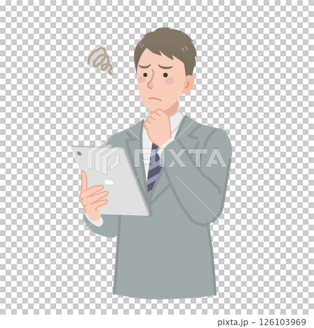 A worried businessman looking at a tablet A worried businessman looking at a tablet 126103969