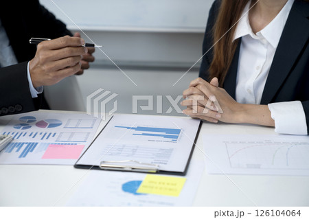 businessman holding a pen and hands to explain the details to the participant businessman holding a pen and hands to explain the details to the participant 126104064