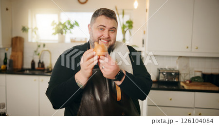Happy man, chef and cooking with onion in kitchen for main ingredient, flavor or starter at home. Portrait, male person or culinary artist with smile or vegetable for meal prep, antioxidant or recipe 126104084