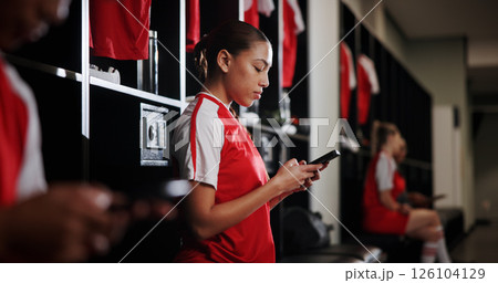 Rest, soccer and woman with phone in locker room for social media, contact and communication for game. Athlete, football and person typing on smartphone for match, training and tournament schedule 126104129