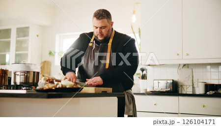 Man, chef and cutting in kitchen with food for meal prep, dinner or private catering service at home. Male person, culinary artist or chopping board with stove for hospitality, recipe or ingredients Man, chef and cutting in kitchen with food for meal prep, dinner or private catering service at home. Male person, culinary artist or chopping board with stove for hospitality, recipe or ingredients 126104171