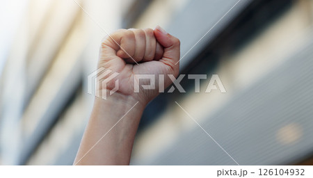Hands, person and fist for protest outdoor for justice, government change and fighting for human rights. Closeup, protester and hand gesture for equality, rally vote and stop corruption of propaganda 126104932