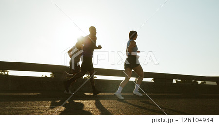 People, back and running with sunshine in city for workout, exercise or training on road. Active group, friends or runners with bridge for sport, marathon or outdoor sprint together in an urban town People, back and running with sunshine in city for workout, exercise or training on road. Active group, friends or runners with bridge for sport, marathon or outdoor sprint together in an urban town 126104934