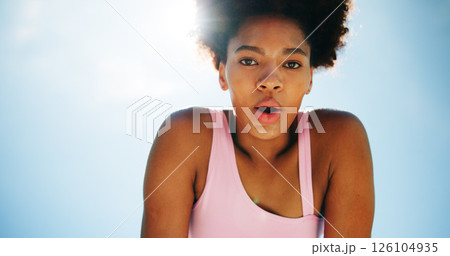 Breathing, fitness and portrait of black woman on blue sky outdoor for break, fatigue or recovery. Exercise, sweating and tired with athlete or runner resting for below for training or workout Breathing, fitness and portrait of black woman on blue sky outdoor for break, fatigue or recovery. Exercise, sweating and tired with athlete or runner resting for below for training or workout 126104935