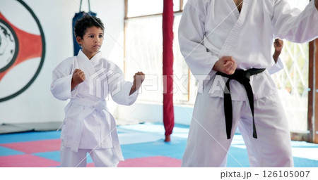 Boy, lesson and sensei with student in karate class, self defense pose or martial arts with youth for combat education. Taekwondo training, stance and instructor with male child for coaching in dojo Boy, lesson and sensei with student in karate class, self defense pose or martial arts with youth for combat education. Taekwondo training, stance and instructor with male child for coaching in dojo 126105007