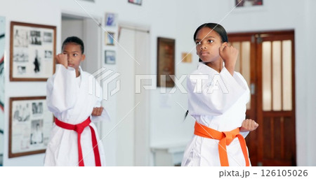 Girl, children or karate student in dojo for combat, fighting tournament or sports training with dedication. Exercise, fitness workout or kids in gym for martial arts education, development or growth Girl, children or karate student in dojo for combat, fighting tournament or sports training with dedication. Exercise, fitness workout or kids in gym for martial arts education, development or growth 126105026