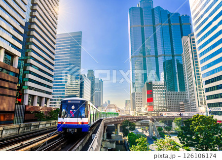 BTS Skytrain travels through central Bangkok surrounded by modern skyscrapers on a clear sunny morning BTS Skytrain travels through central Bangkok surrounded by modern skyscrapers on a clear sunny morning 126106174