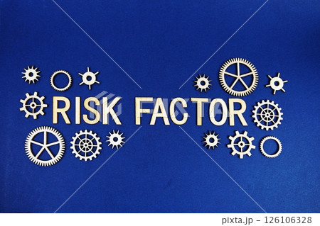 Risk Factor alphabet letters with gears element on navy blue background Risk Factor alphabet letters with gears element on navy blue background 126106328