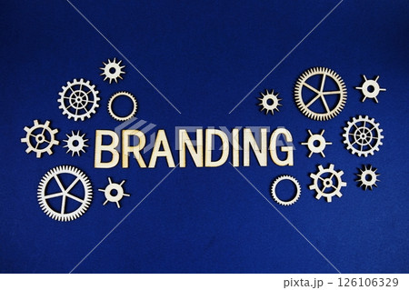 Branding alphabet letters with gears element on navy blue background 126106329