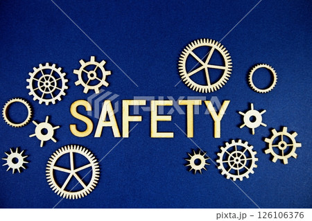 Safety alphabet letters with gears element on navy blue background 126106376