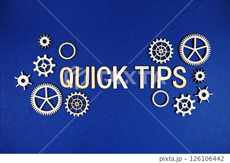 Quick Tips alphabet letters with gears element on navy blue background 126106442