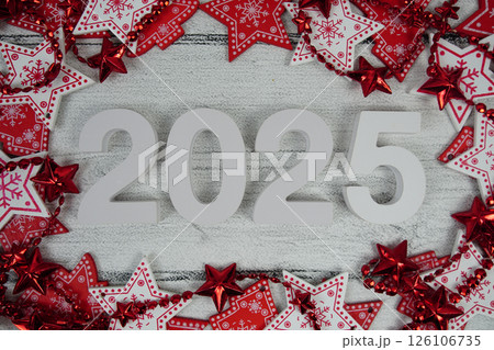 Happy New Year 2025 alphabet letters with Christmas decoration on pink background Happy New Year 2025 alphabet letters with Christmas decoration on pink background 126106735