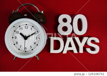 80 Days alphabet letters with alarm clock on red background 126106742