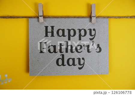 Happy Father's Day text on paper card on yellow background 126106778