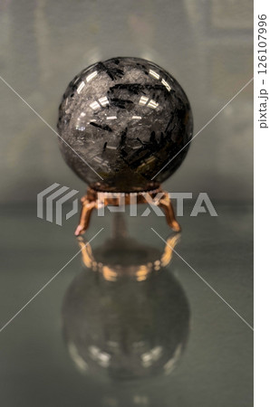 Tourmalinated Quartz Crystal Sphere on Ornate Gold Stand Tourmalinated Quartz Crystal Sphere on Ornate Gold Stand 126107996
