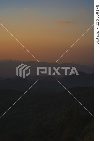 nature traveling with orange sky and layer of mountain with sunrise background 126108148