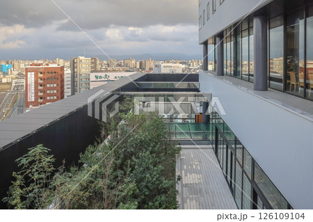 March 24 2025 Urban Building With Terrace Overlooking City Skyline, Japan March 24 2025 Urban Building With Terrace Overlooking City Skyline, Japan 126109104