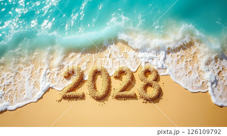 Sand numbers carved on a beach represent the upcoming year 2028 with waves gently touching the shore Sand numbers carved on a beach represent the upcoming year 2028 with waves gently touching the shore 126109792