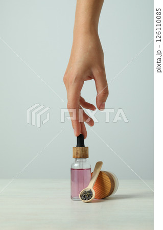 Lavender oil in a bottle on a light background 126110085