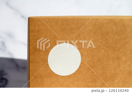 Brown Paper Package with Blank White Label 126110240
