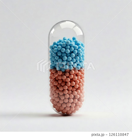 Colorful capsule filled with blue and pink spheres in a minimalist setting shows contrast in design and texture 126110847