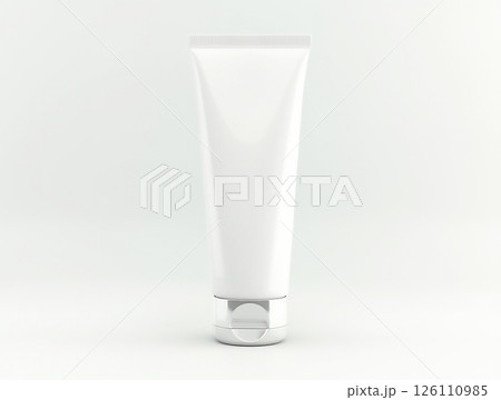 Elegant white cosmetic tube with a silver cap displayed on a neutral background in a minimalist setting 126110985