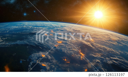 Earth from space, with the sun shining brightly on the right side of the image. The Earth is shown from a high angle, with its blue oceans and green landmasses visible	 126113197