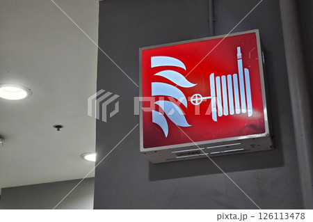 Fire Hose Reel Sign on Stucco Wall Fire Hose Reel Sign on Stucco Wall 126113478