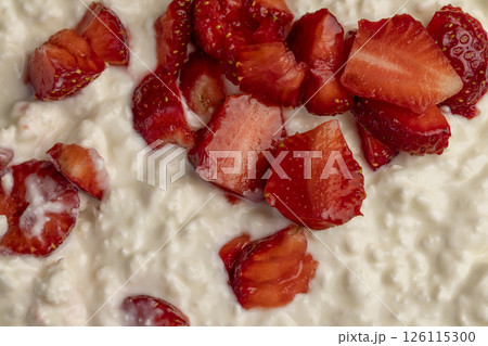low-calorie cottage cheese with sour cream and fresh red strawberries, white sour-milk cottage cheese with strawberries low-calorie cottage cheese with sour cream and fresh red strawberries, white sour-milk cottage cheese with strawberries 126115300