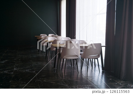 Empty chairs and tables in a cafe, vintage style, selective focus Empty chairs and tables in a cafe, vintage style, selective focus 126115563