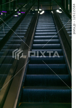 Escalator in a modern shopping center, closeup of photo 126115564