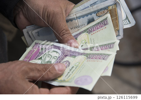 Banknotes in hand. Top view. Counting or spend money. Banknotes in hand. Top view. Counting or spend money. 126115699
