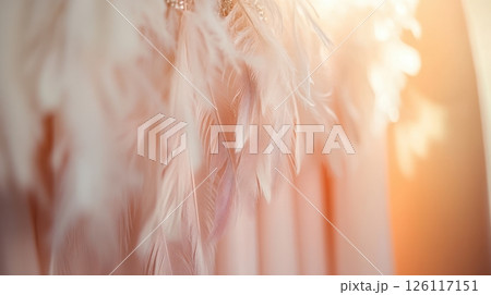 Close-up of blouse with feather accents in elegant boutique. Soft pastel tones and luxurious textures make this scene perfect for fashion and retail visuals. 126117151