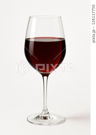 A close-up of a refined red wine glass with elegant stemware on a dining table. Perfect for wine tasting, with vibrant color and clarity, ideal for an intimate celebration or luxury event. 126117750
