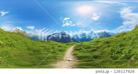 Beautiful mountain landscape at sunrise with winding path through green grass leading to snow-capped peaks in soft light panoramic view concept of travel wellness tourism nature art 126117926