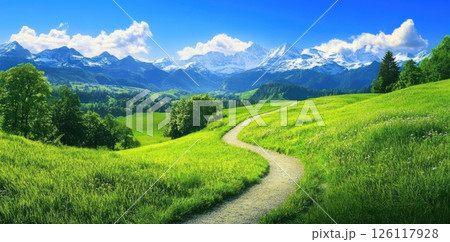 Scenic mountain panorama with winding path leading through grassy hills to snow-capped peaks under clear blue sky idyllic natural landscape concept of travel tourism wellness retreat 126117928